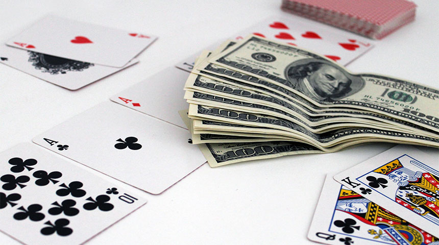 cards and dollar - 3 Movies to Improve Your Michigan Gambling